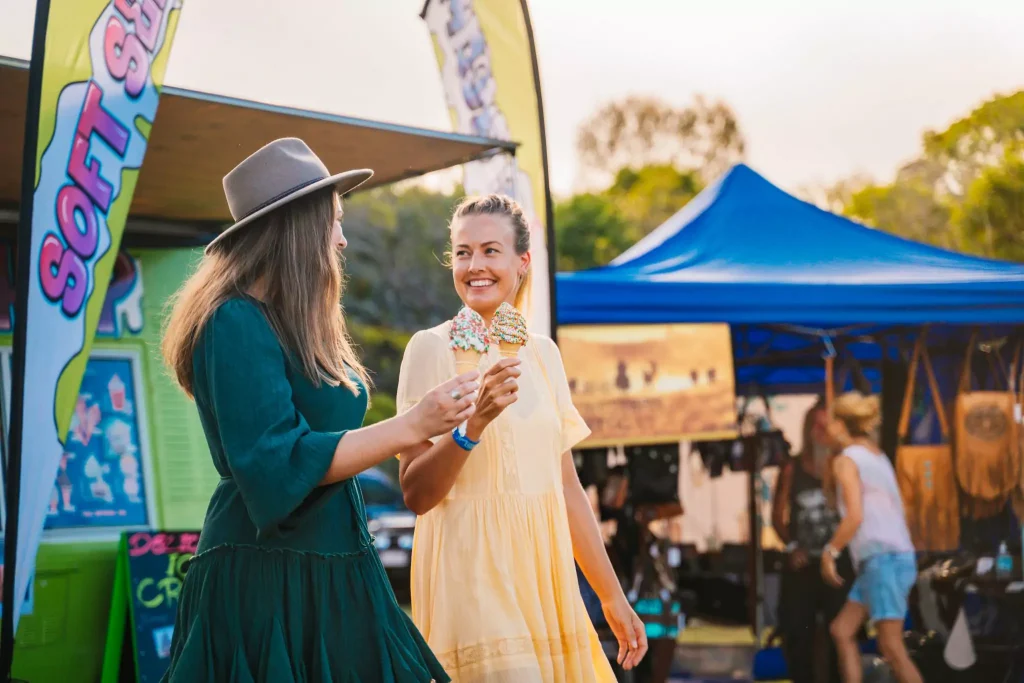 Two woman eating ice cream
